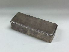 An engine turned silver snuff box with gilt interi