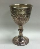 A good quality chased silver goblet of scroll form