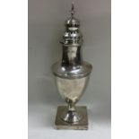 A good Georgian silver sugar caster with reeded bo