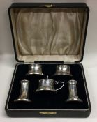 A good cased silver and Bakelite five piece cruet