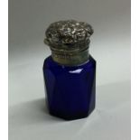 A blue glass silver mounted scent bottle with embo