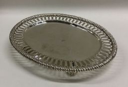 A Georgian style Victorian silver teapot stand wit