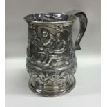 A heavy chased Georgian silver tankard decorated w