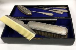 A good engine turned silver manicure set contained