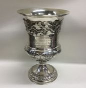 A good Georgian silver goblet decorated with leave