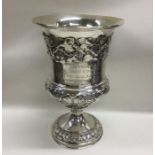 A good Georgian silver goblet decorated with leave