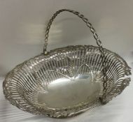 DUBLIN: A Georgian silver swing handled basket wit