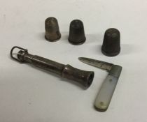 A small silver cigar piercer together with silver