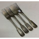 A good set of four Georgian silver fiddle pattern