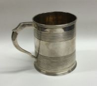 A Georgian silver tapering cup of reeded form. App