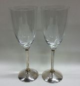 A good pair of silver and glass champagne flutes o