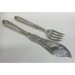 A good pair of Victorian silver pierced fish serve