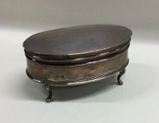 An oval silver hinged top ring box. Birmingham. By