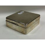 An engine turned silver cigarette box with hinged