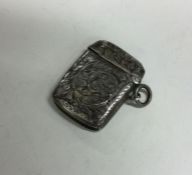 An engraved silver vesta case decorated with flowe