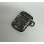 An engraved silver vesta case decorated with flowe