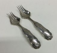 A pair of attractive Dutch silver forks with scrol