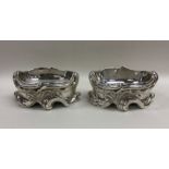 A pair of heavy Victorian silver scroll decorated