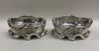 A pair of heavy Victorian silver scroll decorated