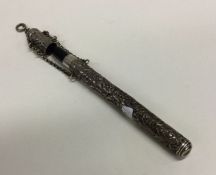 An unusual silver embossed pen holder with suspens