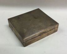 A small silver hinged top cigarette case. London.