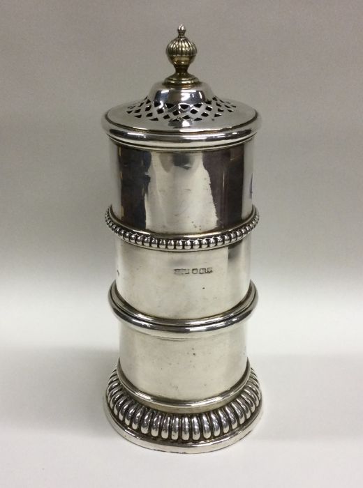 A rare stylish silver sugar caster with bead decor