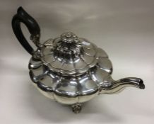 A heavy silver melon shaped teapot with hinged cov