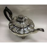 A heavy silver melon shaped teapot with hinged cov