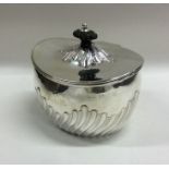 A good silver half fluted tea caddy with hinged li