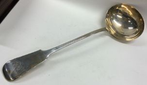EXETER: A large fiddle pattern silver soup ladle w