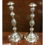 A tall pair of Russian style silver candlesticks w