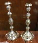 A tall pair of Russian style silver candlesticks w