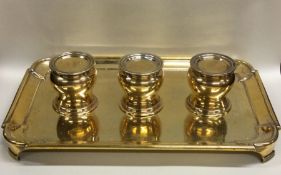 A rare silver gilt three bottle inkstand in George