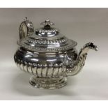 GLASGOW: A good Georgian circular silver teapot on