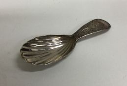 A Georgian silver bright cut caddy spoon. London.