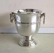 A stylish silver two handled vase on pedestal base