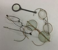 A bag containing gold mounted and other spectacles