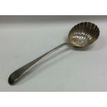 A Georgian OE pattern silver ladle with fluted bow