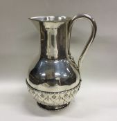 JOHN HARDMAN: A stylish silver ewer with textured