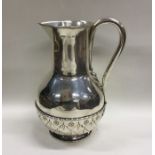 JOHN HARDMAN: A stylish silver ewer with textured