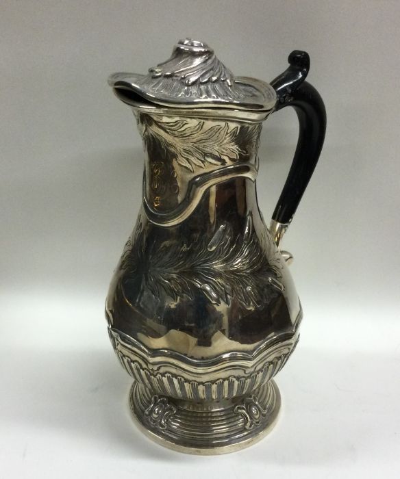 A heavy Georgian silver baluster shaped ewer with