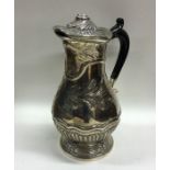 A heavy Georgian silver baluster shaped ewer with