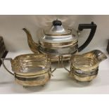 A heavy large Edwardian silver three piece tea ser