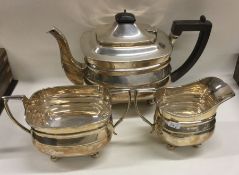 A heavy large Edwardian silver three piece tea ser