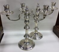 A good pair of Georgian style candelabra of circul