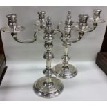 A good pair of Georgian style candelabra of circul