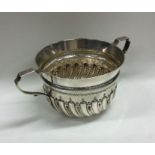 A Victorian silver half fluted porringer of typica