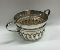 A Victorian silver half fluted porringer of typica