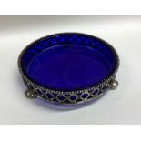 A circular pierced silver coaster with beadwork de