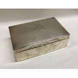 A rectangular hinged top silver cigarette box. Lon